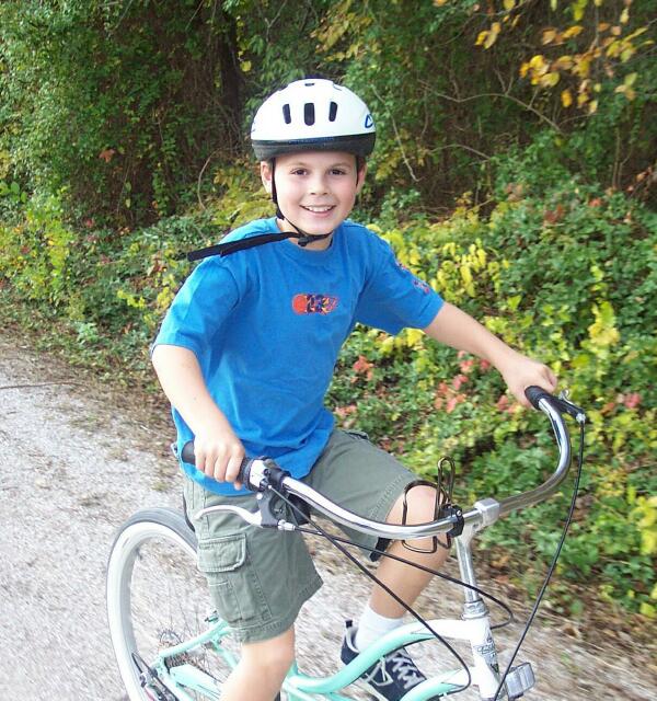 Sam rides a bike on the Katy Trail