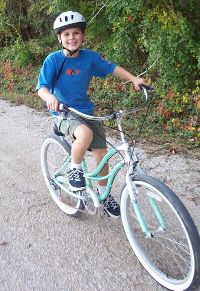 Sam rides a bike down the Katy Trail